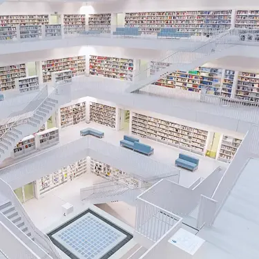 Modern multi-level library with bookshelves and staircases.